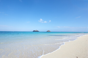 Ocean, shore and blue sky for holiday, sand and rocks in Hawaii for peace and tranquility. Seaside,...