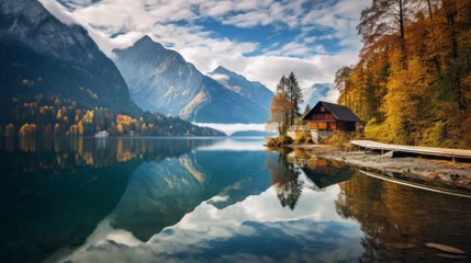 Badezimmer Foto Rückwand Reflection Spectacular Scenic landscape. High Mountains with clouds are reflected on a clear Lake. The House By The Lake In Autumn.