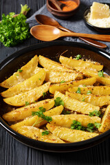 greek lemon potatoes with garlic, cheese on dish