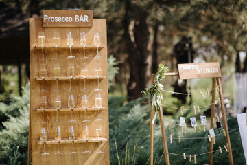 The waiter fills the glass with champagne. Catering, welcome drink, service, alcohol. A solemn event