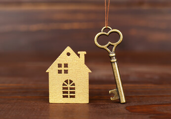 House and gold key, buying, selling or renting home. Loan. Real estate background. - 749333639