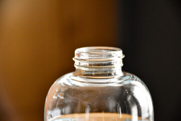 The neck of a glass bottle with clean water