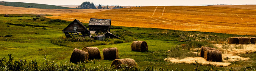 Fall drive thru Wheatland County past rustic buildings and farm fields, Alberta, Canada