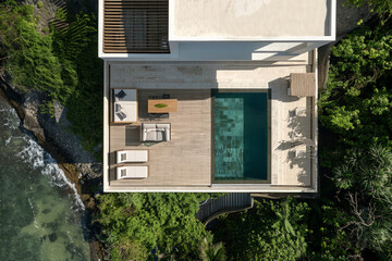 luxury home on a beach and pool in tropical landscapes