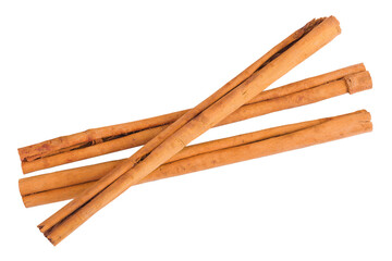 Cinnamon sticks with powder in wooden spoon isolated on white background with full depth of field. Top view. Flat lay.