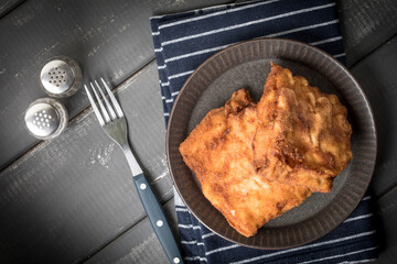 Two fried cod fillet pieces.