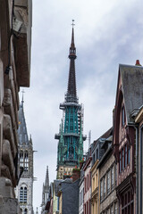 Fototapeta na wymiar Facade of half-timbered houses in the city of Rouen in France, acev its church