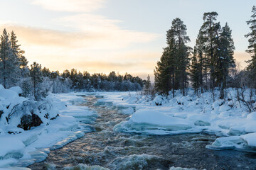 River in Finnish Lapland between ice and snow