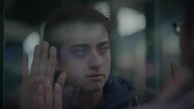 Mother Saying Goodbye to Son Waving Hands and Leaving Unhappy