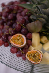 Fruit platter with grapes, ananas and passion fruit