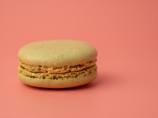 Colorful French macaroons on a pink background. French macaroons close-up.