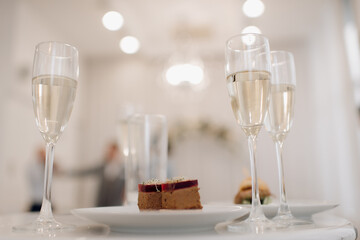 A small tasting glass of sparkling champagne. An unfinished glass of alcohol. Drink champagne or a cocktail. A dirty glass