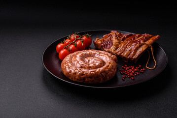 Delicious grilled sausage in the form of a ring with salt, spices and herbs