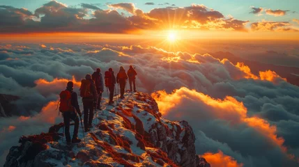 Türaufkleber Happy friends or tourists are greeting sunrise or sunset high on the mountain above the clouds © Dushan
