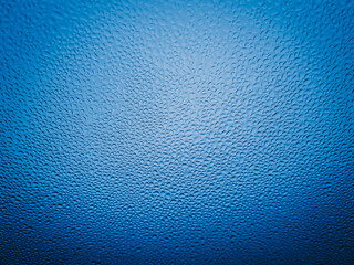 Fine raindrops on the car glass after waxing.