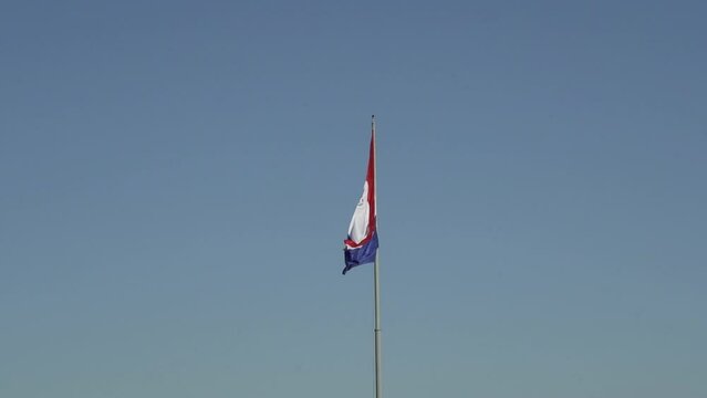 National flag of Paraguay waving in the wind at Cerro Cora national park.