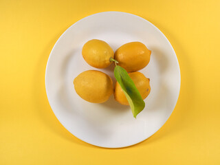 lemons in a dish flat view - 749402834