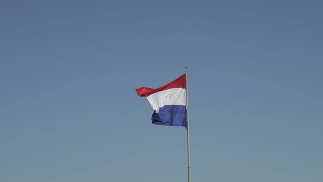 National flag of Paraguay waving in the wind at Cerro Cora national park.