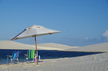 beach chairs and umbrella on beach