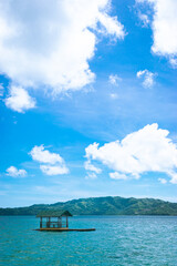 Blue sea viewed on a floating house. Portrait. Looc Fish Sanctuary, Romblon, Philippines