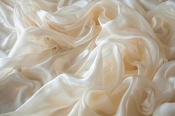 Fototapeta premium Close-up of white fabric with delicate folds, draped on a smooth surface