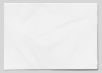 Lightly crumpled sheet of white paper with detailed edges isolated on gray background