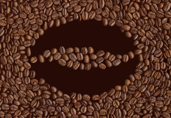 Layout of coffee beans in the form of coffee bean isolated on dark background with copy space