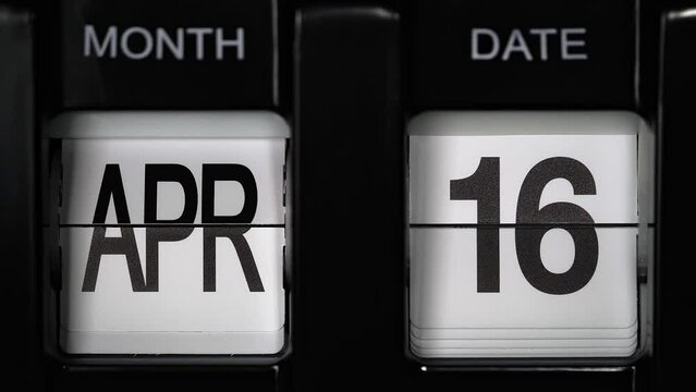 retro flip calendar with a date change from the fifteenth of April to the sixteenth of April. daily calendar with a change of days of the month. close up.