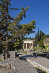 view to the Athenian treasury at the ancient oracle archaeological Delphi site, Greece
