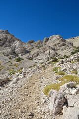 Hiking stone path towards the Vraca pass on the island of Krk, Croatia