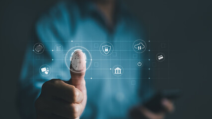 Cyber security concept. Businessman using thumb to scan fingerprint or for digital processing biometric identification to access security system including Internet banking, Cloud computing, Big data,