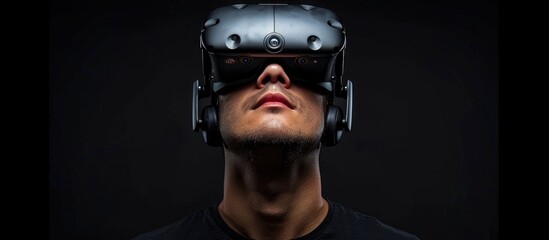 A man with headphones VR device on his face.