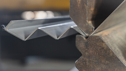 Metal stainless sheet bending on hydraulic machine.  bending stainless sheet. 