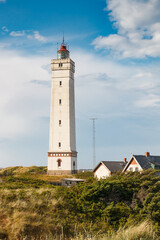 Lighthouse in the sand dunes on the beach of Blavand, Jutland Denmark Europe