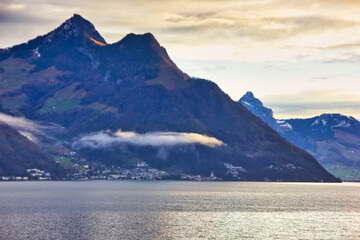 Sunset over the lake in the Alps, in winter