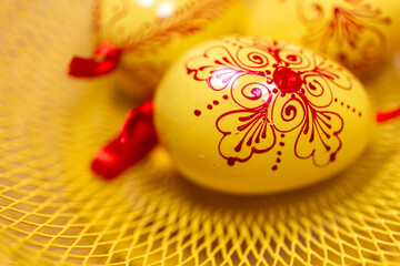 Easter eggs on a yellow tray.