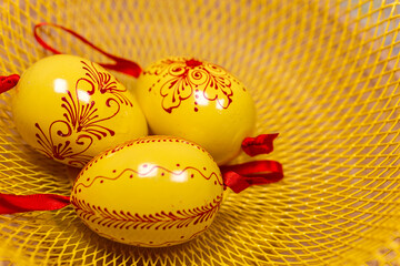 Easter eggs on a yellow tray.