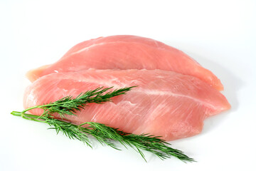 raw chicken fillet decorated with dill isolated on white background 