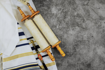 There are symbols associated with Jewish Orthodox holidays: prayer shawl tallit, torah scroll