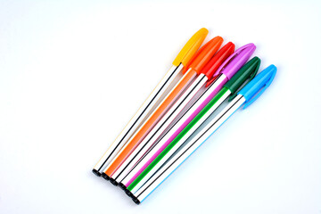 Colorful pens isolated on white.