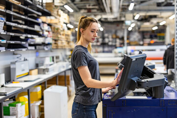 Woman working in a printing factory 