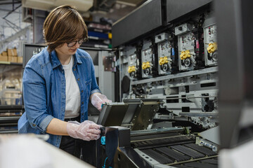 Woman working in a printing factory
