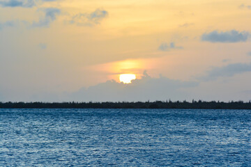  Scenic view of colourful sky during sunset in Caribbean sea.