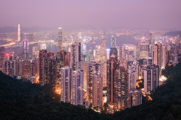 Hong Kong urban skyline with high skyscrapers during moody dusk. . - obrazy, fototapety, plakaty