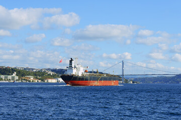 Ship passing the Bosphorus Bridge at Besiktas, Istanbul, Turkey