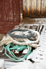 Frozen ropes at a wooden fishing hut, northern Norway