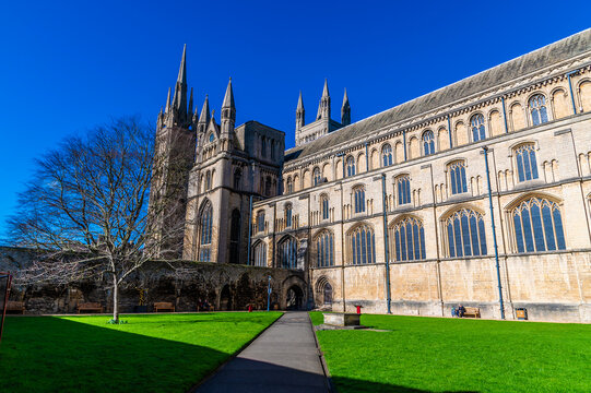 A view along an path towards the cathedral in Peterborough, UK on a bright sunny day