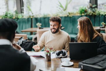 Smiling business colleagues collaborating in a casual office setting.
