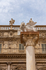 Winged lion with book statue in Verona in Italy.