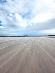 Fototapeta na wymiar Sand storm at Dooey beach by Lettermacaward in County Donegal - Ireland